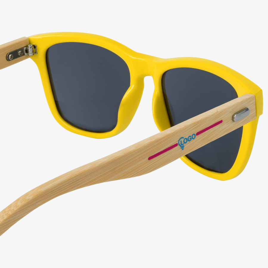 Gelbe Sonnenbrille mit Bügel aus Bambusfaser mit Tampondruck auf dem Bügel