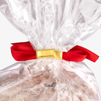 Confiserie-Stollen (alkoholhaltig), Verschluss verziert mit roter Schleife