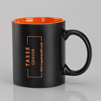 Tasse außen SCHWARZ, innen orange mit einseitiger Lasergravur