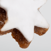 Zimtstern, liegend, weiße Glasur