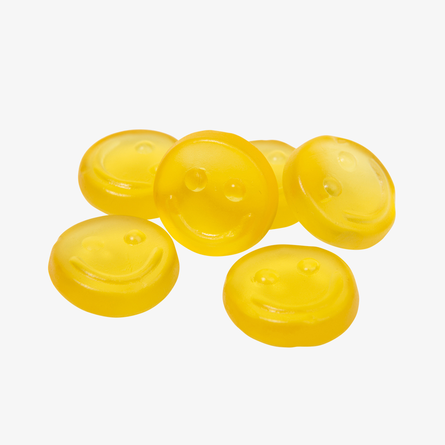 Gelbe Fruchtgummi-Smileys mit köstlichem Zitronengeschmack